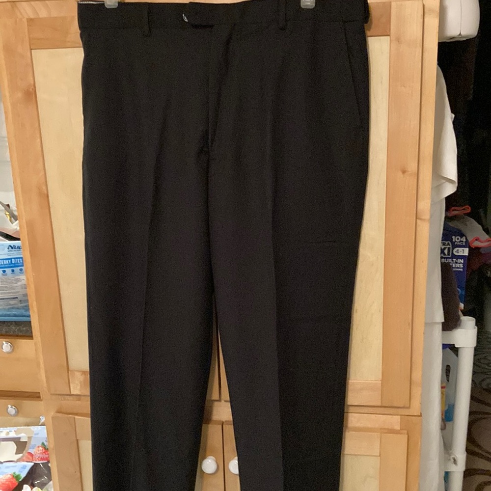 New pair of mens dress pants. Black  pants still has tags.
